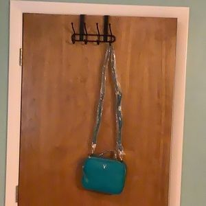Vanessa Williams, teal Crossbody purse, never used. Has handle & strap.
